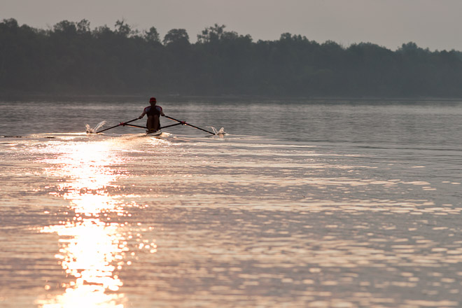 Single skulling and the peace of a early morning sunrise.