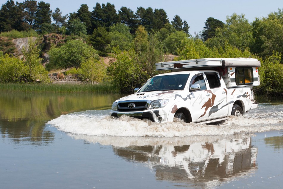 Paula drives through water which is no problem at all to the Toyata Hilux